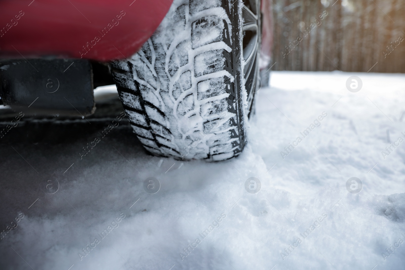 Photo of Car on snowy road, closeup. Space for text