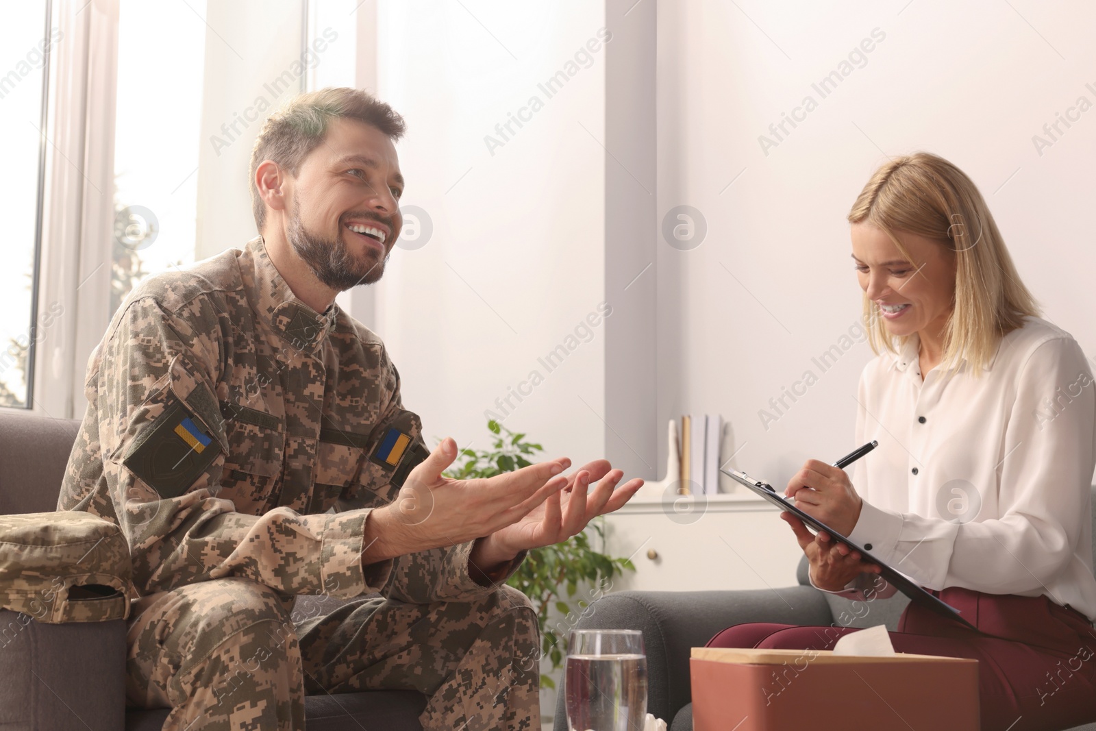 Photo of Psychologist working with military officer in office