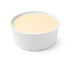 Photo of Bowl with condensed milk isolated on white