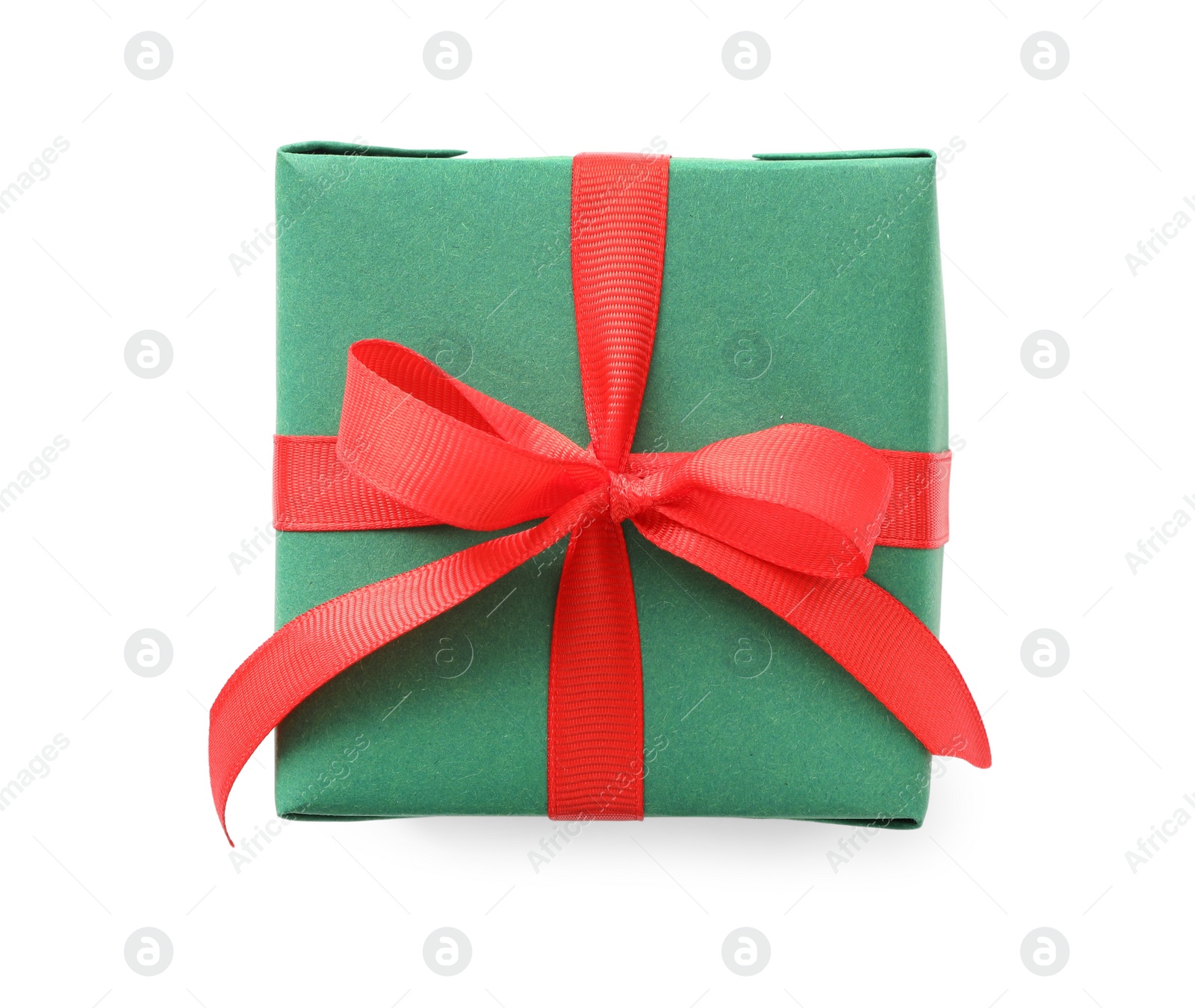 Photo of Christmas gift box decorated with red bow isolated on white, top view