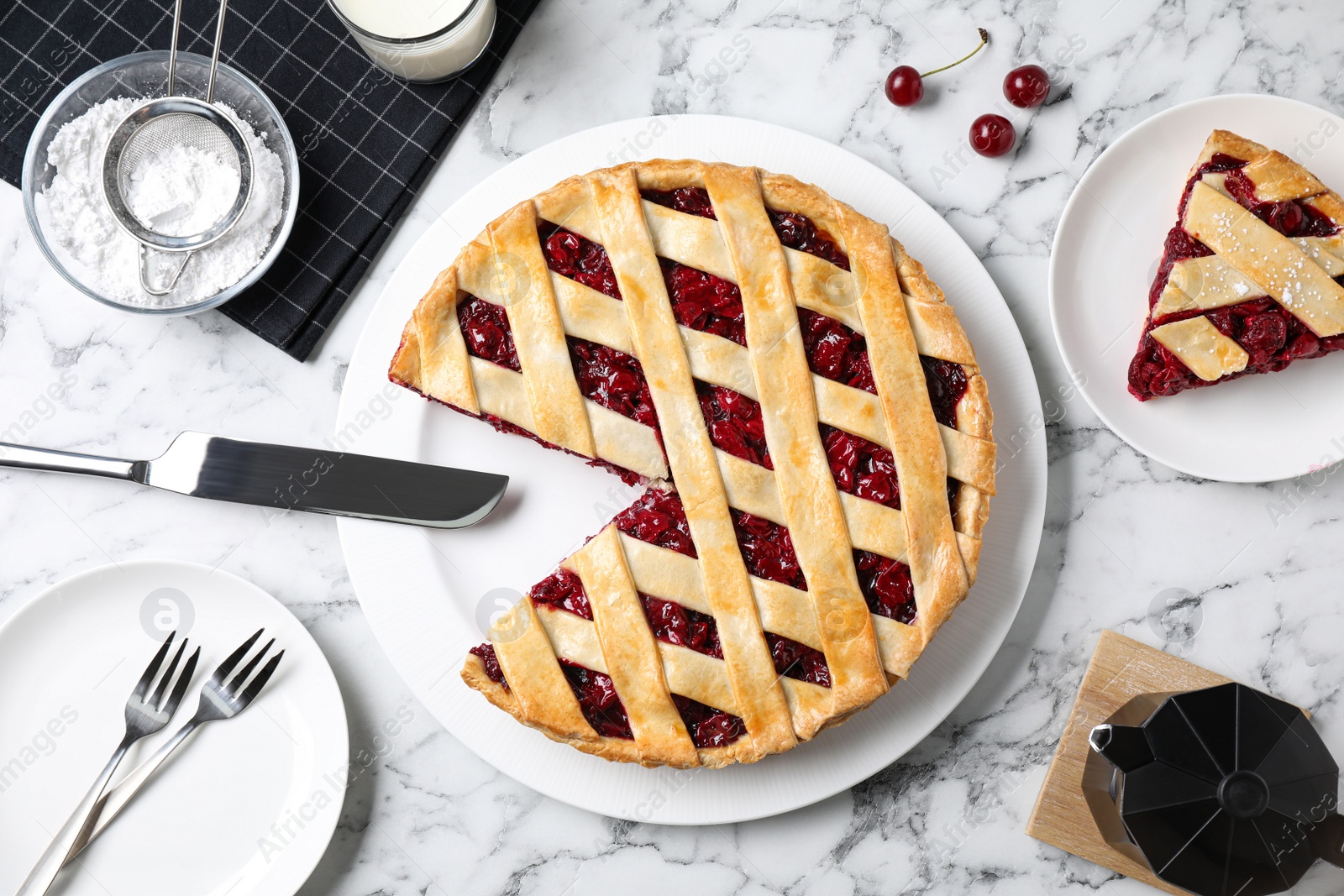 Photo of Delicious fresh cherry pie served on white marble table, flat lay