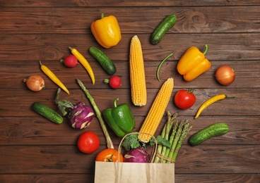 Photo of Flat lay composition with fresh vegetables on wooden background