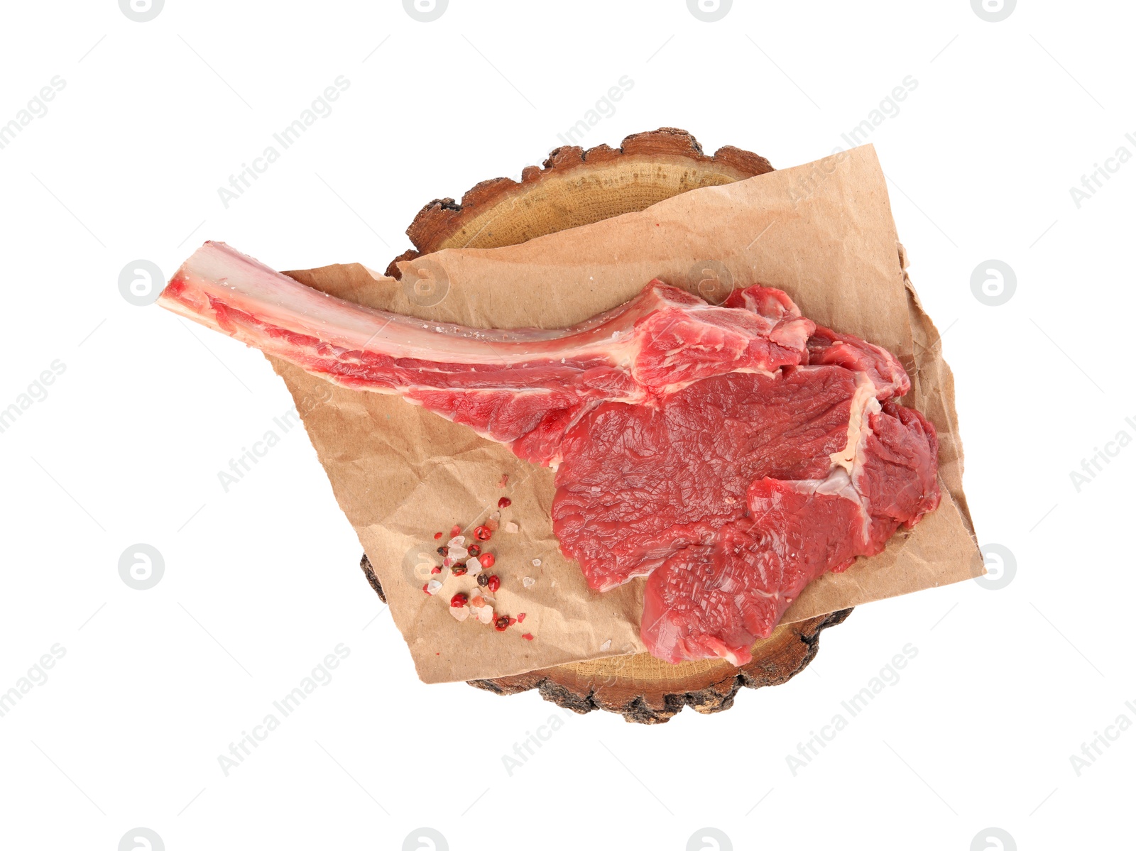 Photo of Raw ribeye steak and spices isolated on white, top view