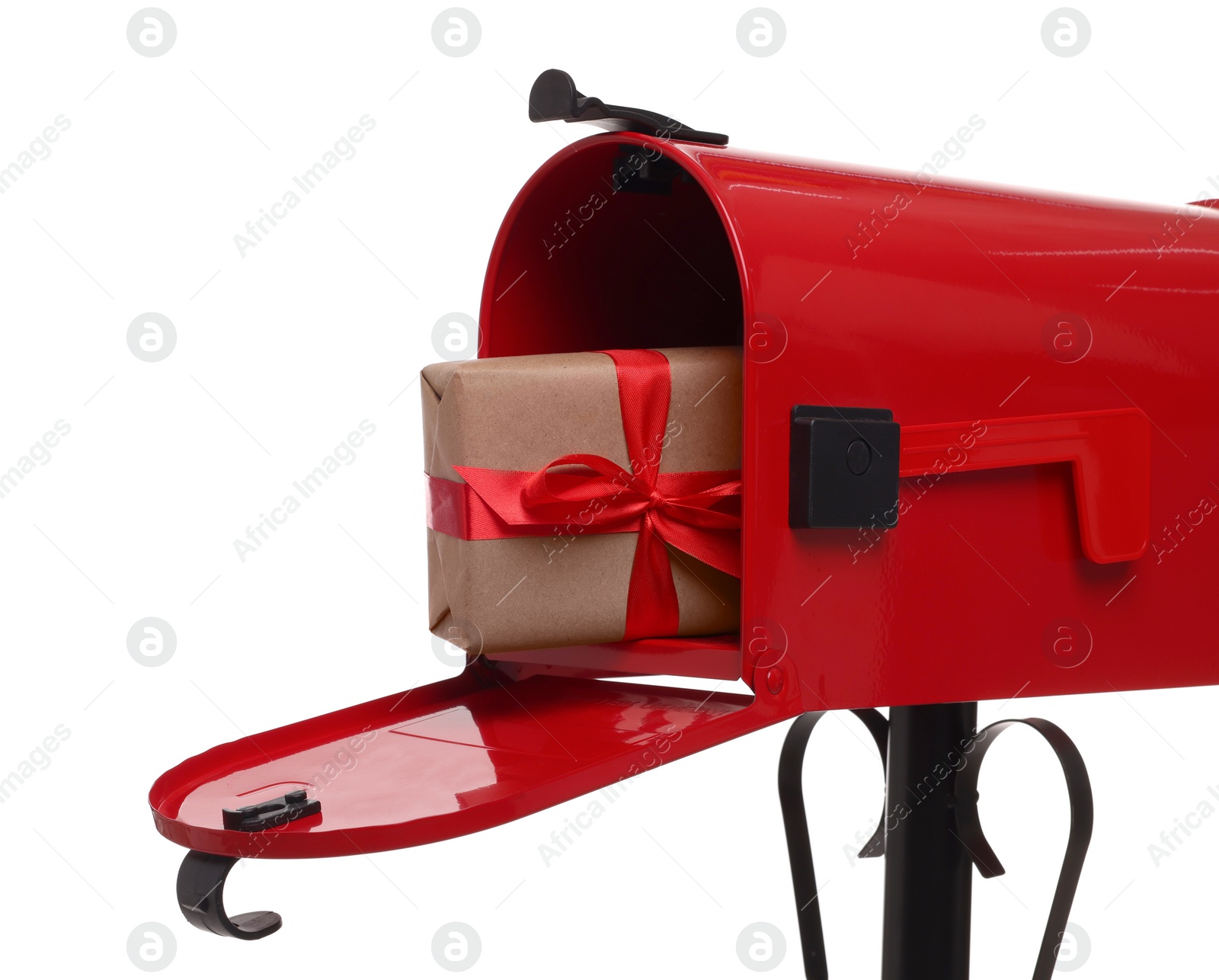 Photo of Red mailbox with Christmas gift isolated on white. Sending present by mail