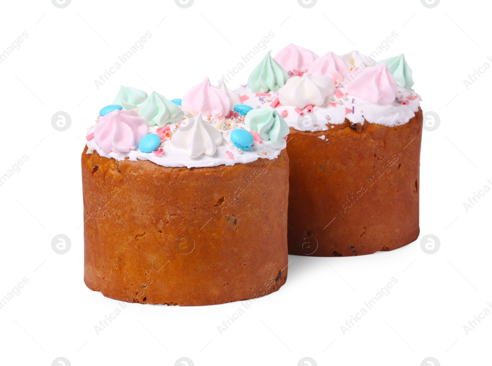 Photo of Traditional Easter cakes with sprinkles and meringues isolated on white