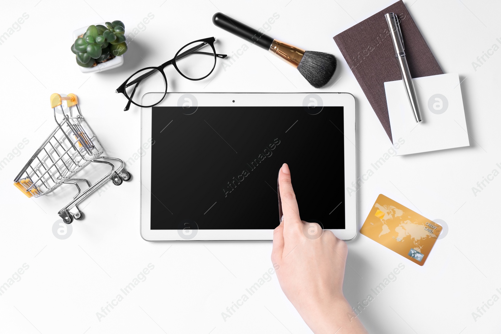 Photo of Online store. Woman using tablet on white background, top view