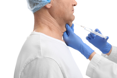 Mature man with double chin receiving injection on white background, closeup