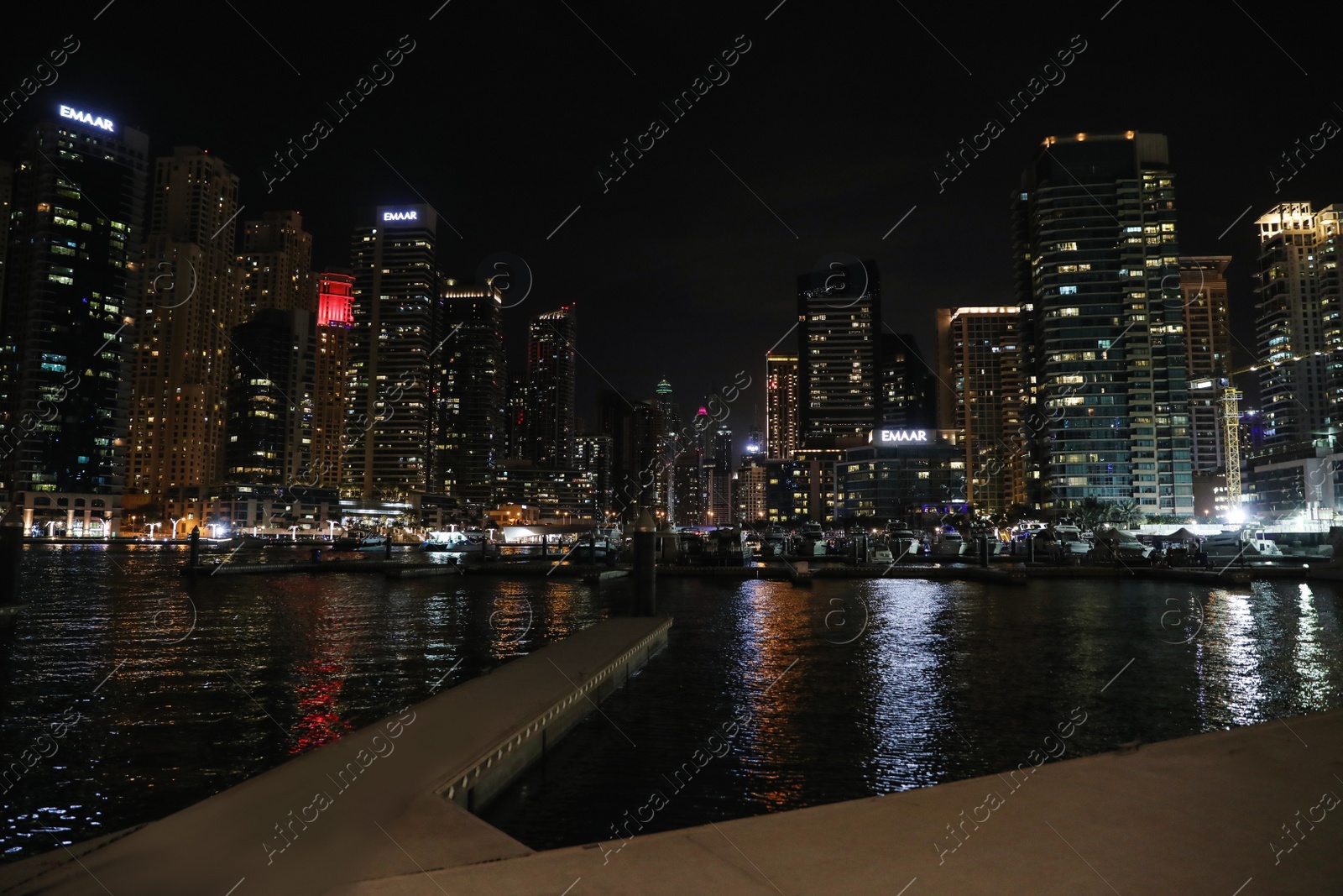 Photo of DUBAI, UNITED ARAB EMIRATES - NOVEMBER 03, 2018: Night cityscape of marina district with illuminated buildings