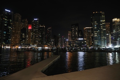 Photo of DUBAI, UNITED ARAB EMIRATES - NOVEMBER 03, 2018: Night cityscape of marina district with illuminated buildings