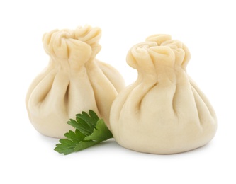 Photo of Boiled dumplings with tasty filling on white background