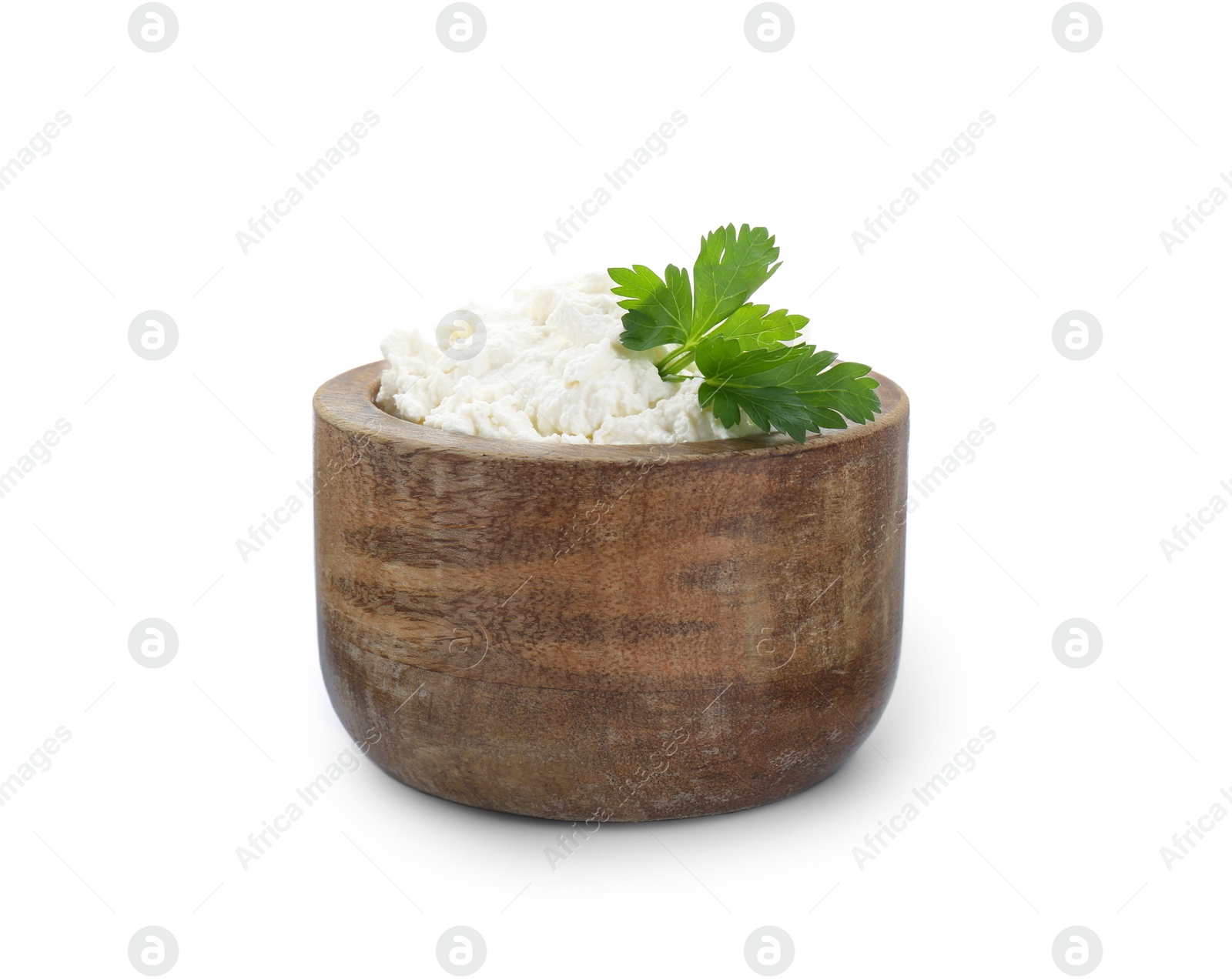 Photo of Delicious tofu cream cheese with parsley in wooden bowl isolated on white