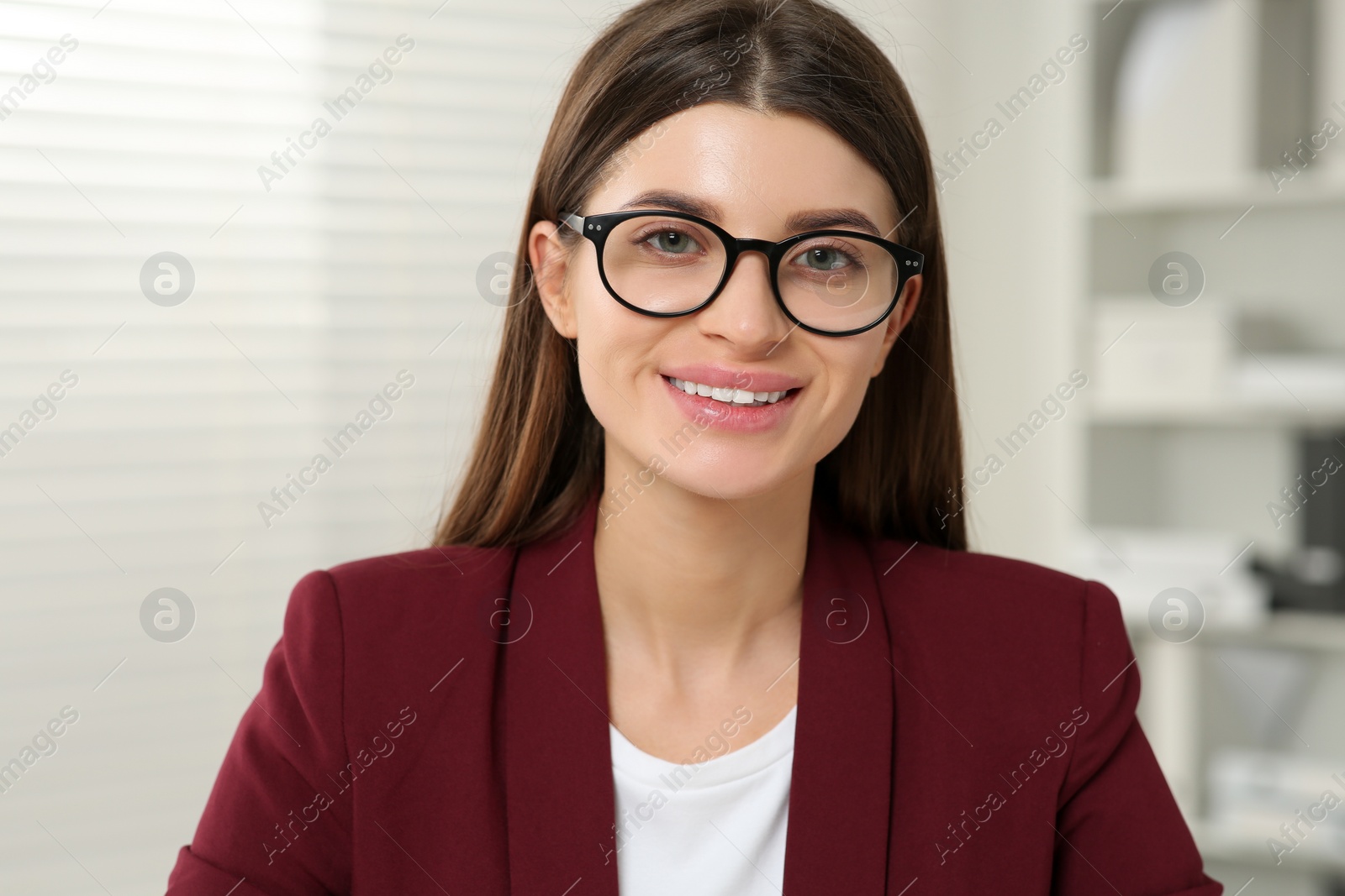 Photo of Happy woman in glasses having online video call at home, view from web camera