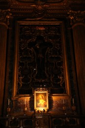 Photo of Rome, Italy - February 3, 2024: Ornate cross design of cruxification of Christ above altar. Church of St. Ignatius of Loyola at Campus Martius