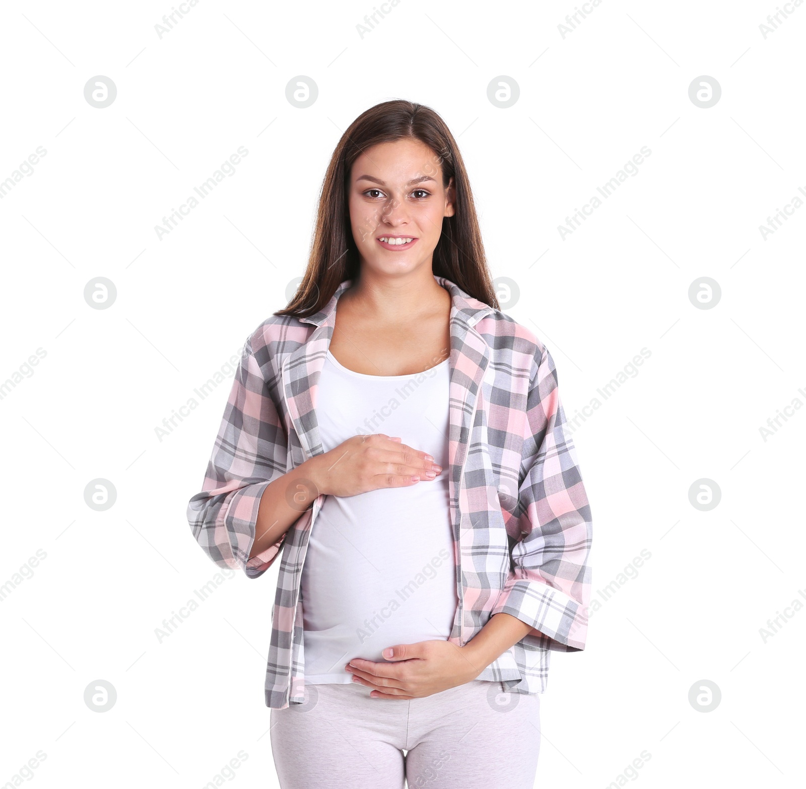 Photo of Happy pregnant woman posing on white background