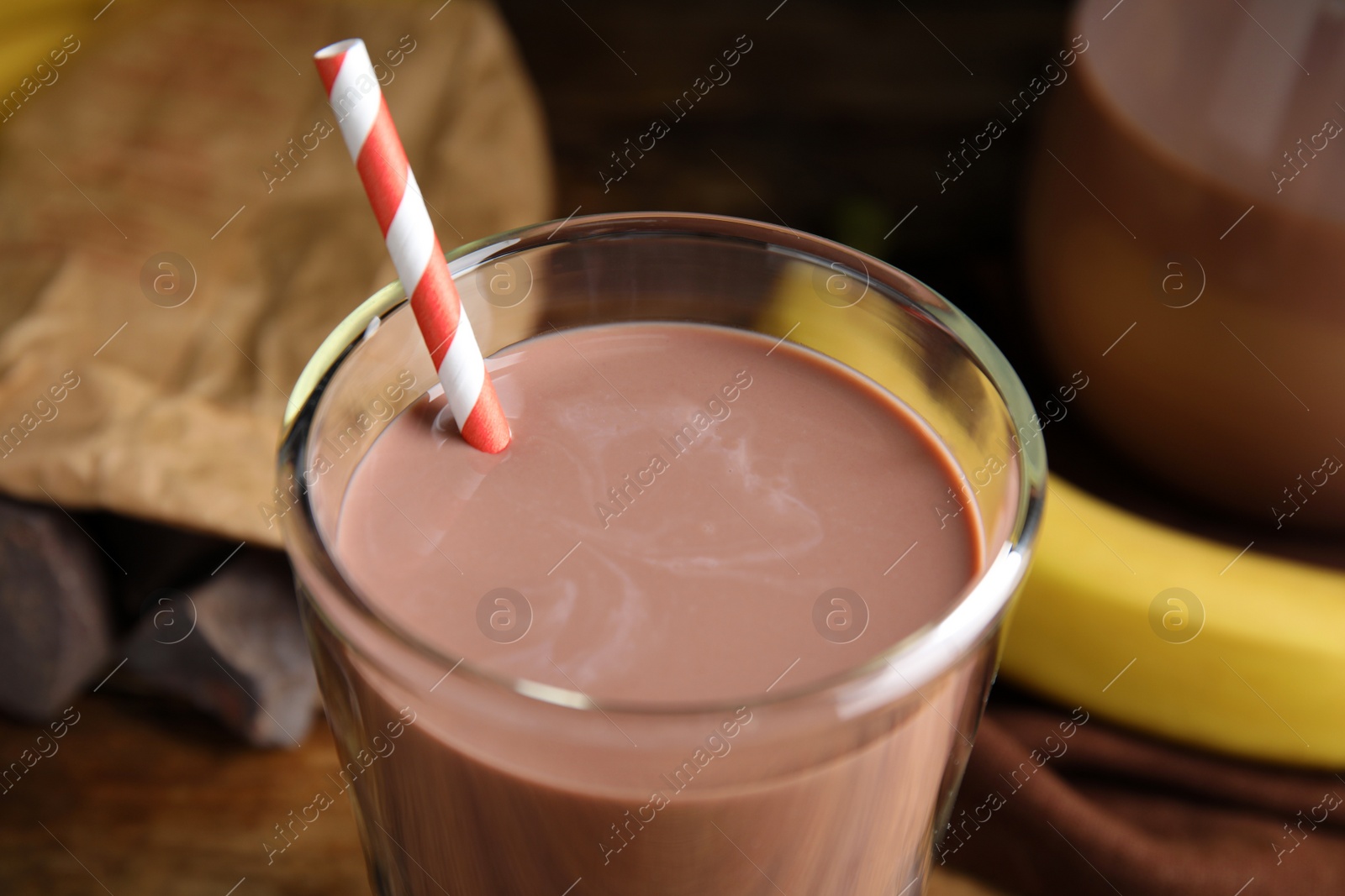 Photo of Fresh yummy chocolate milk on table, closeup