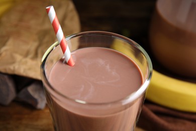 Fresh yummy chocolate milk on table, closeup