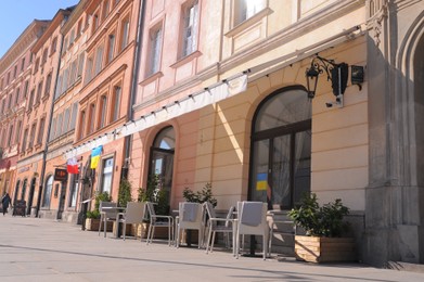Photo of WARSAW, POLAND - MARCH 22, 2022: Beautiful view of modern cafe with outdoor terrace