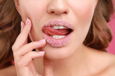 Beautiful young woman with sugar lips, closeup