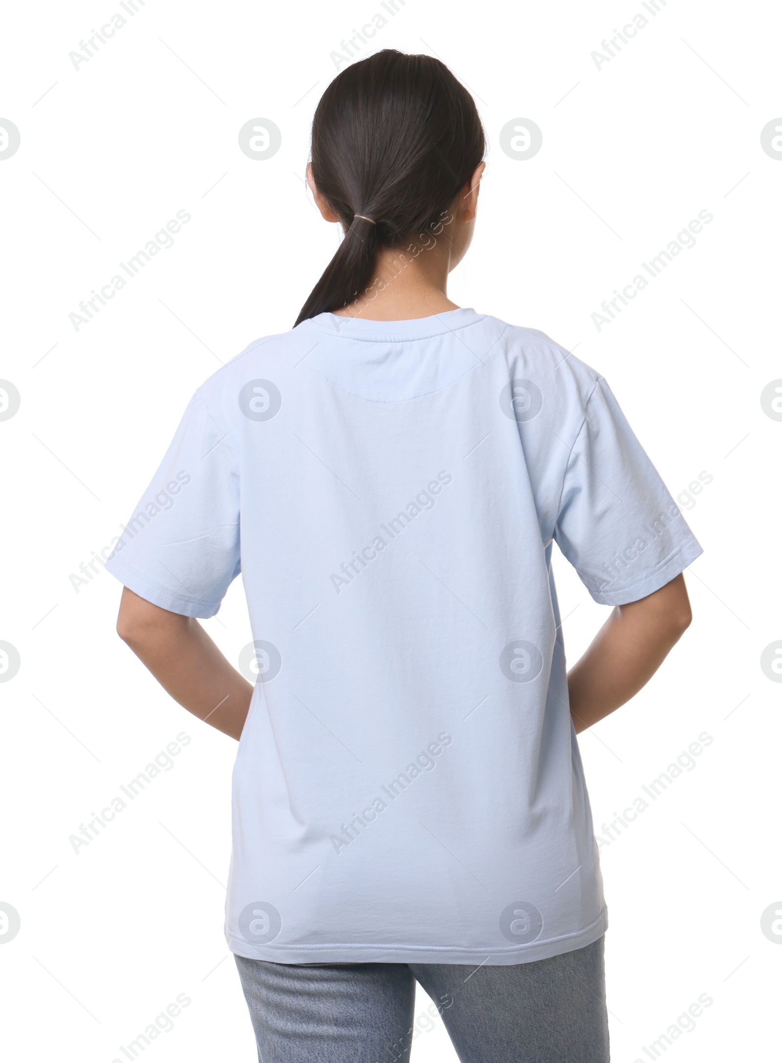 Photo of Woman wearing light blue t-shirt on white background, back view