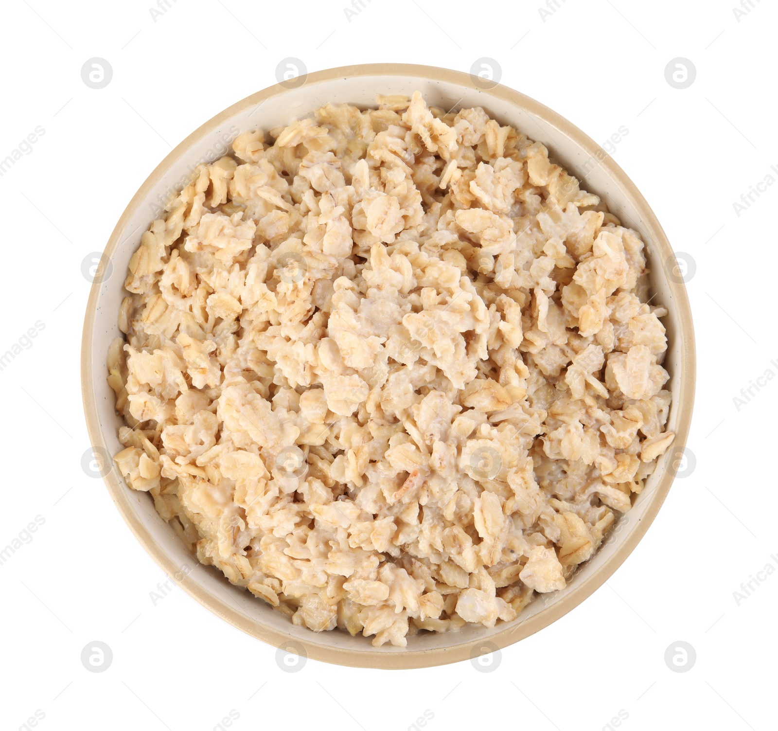 Photo of Tasty boiled oatmeal in bowl isolated on white, top view