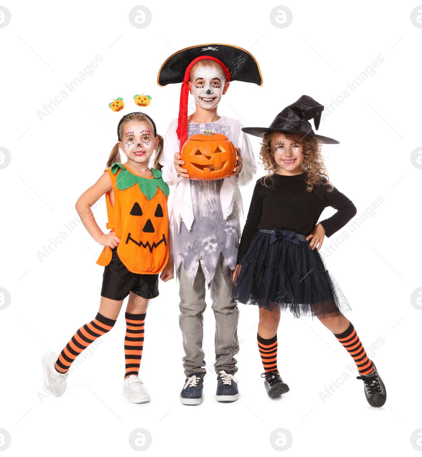 Photo of Cute little kids with pumpkin head jack lantern wearing Halloween costumes on white background