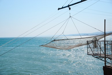 Photo of Shore operated stationary lift net on coast