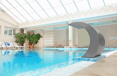 Photo of Swimming pool with refreshing clear water indoors