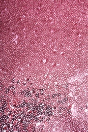 Photo of Fabric with beautiful rose gold paillettes as background