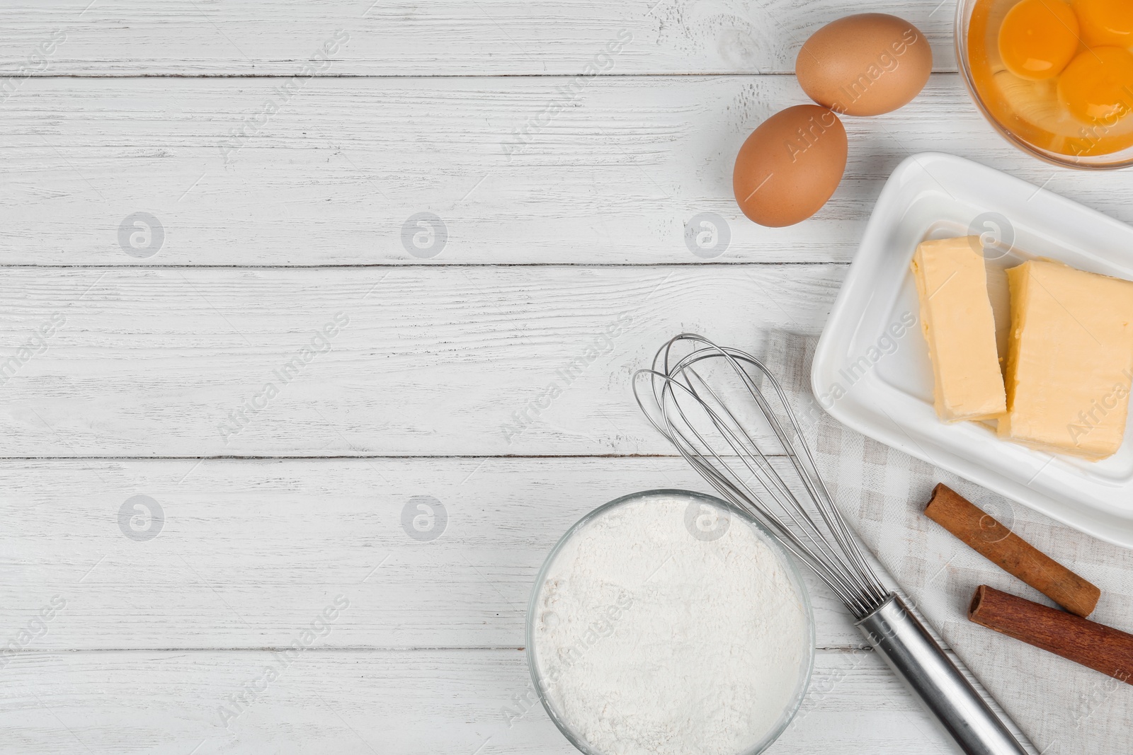 Photo of Flat lay composition with eggs and other ingredients  on white wooden table, space for text. Baking pie