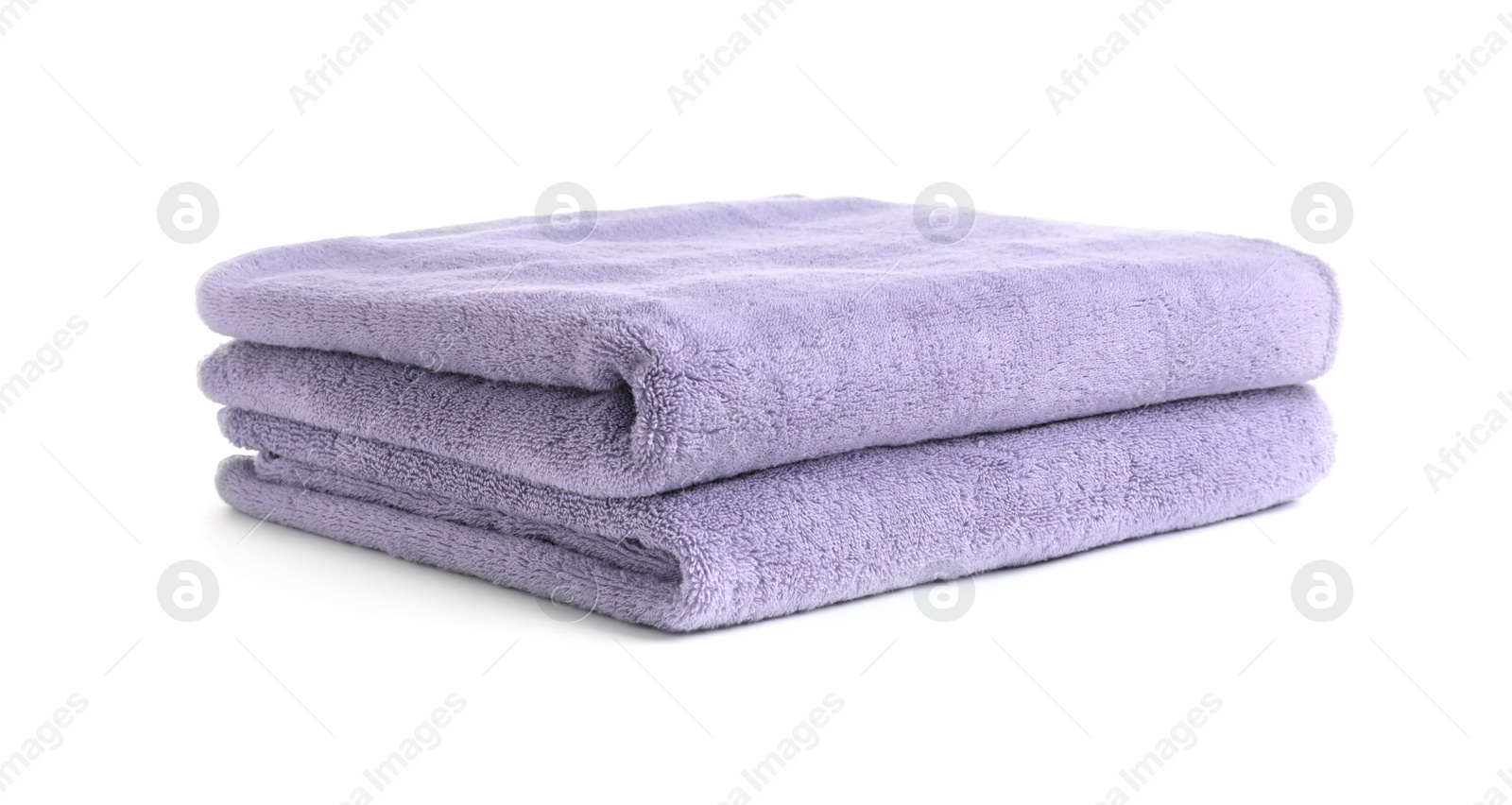 Photo of Folded clean soft towels on white background