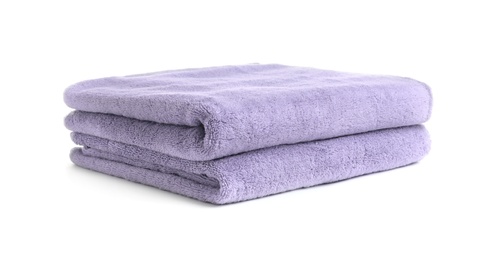 Folded clean soft towels on white background