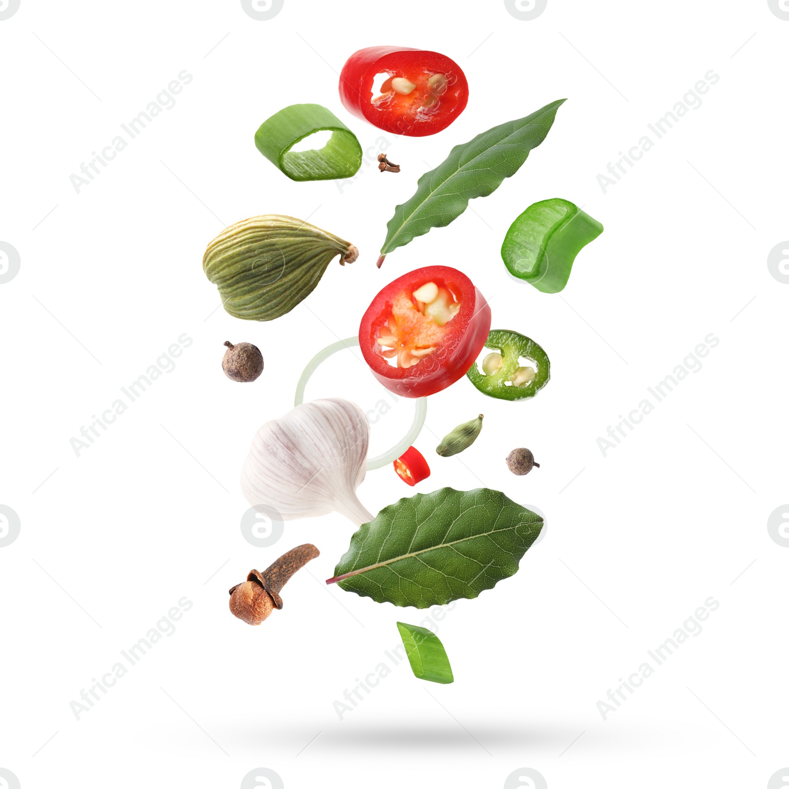 Image of Different aromatic spices falling on white background