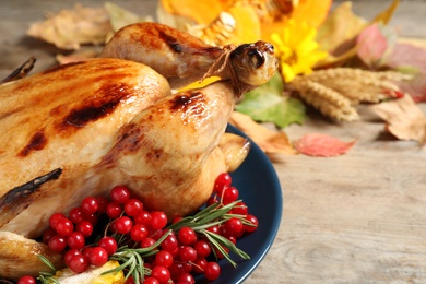Photo of Plate with delicious turkey on wooden background, closeup. Happy Thanksgiving day