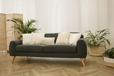 Photo of Stylish living room interior with comfortable sofa