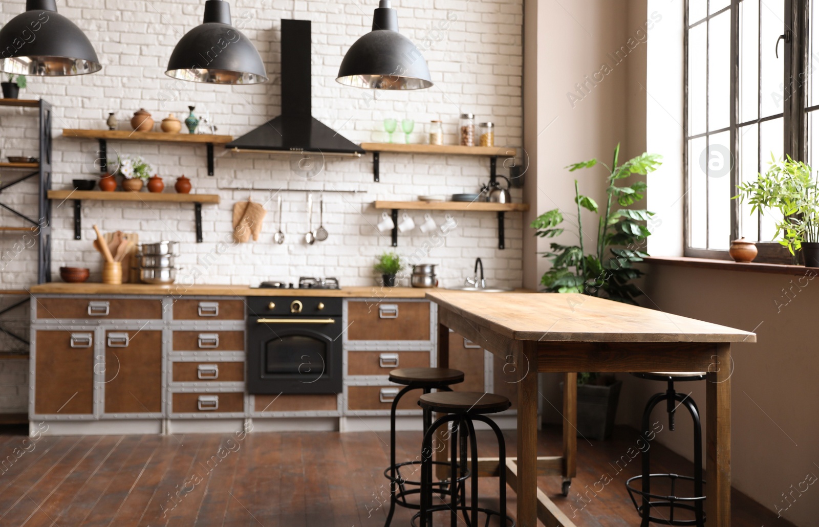 Photo of Beautiful kitchen interior with new stylish furniture and oven