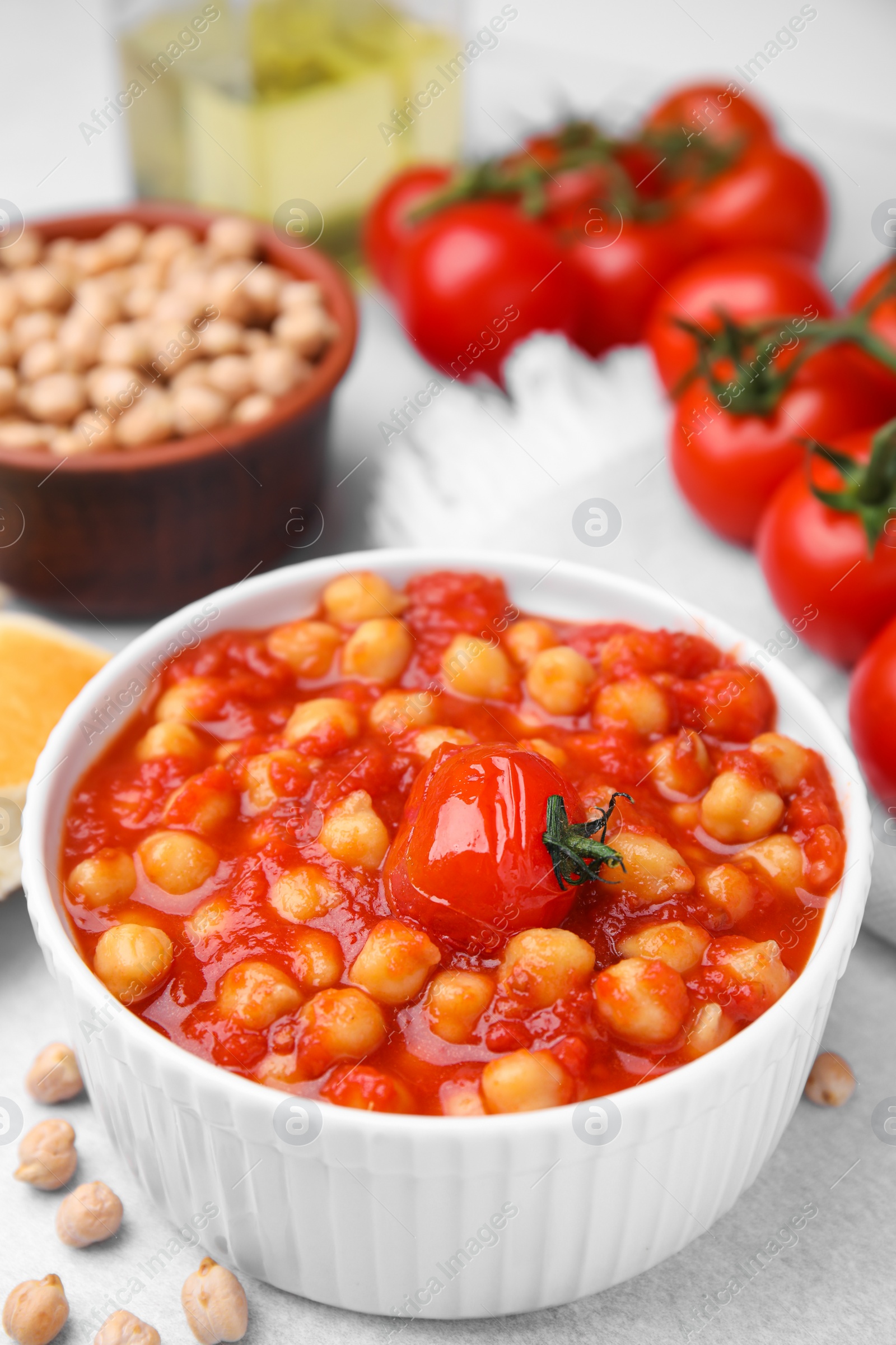 Photo of Delicious chickpea curry in bowl on table, closeup