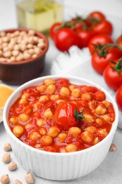 Delicious chickpea curry in bowl on table, closeup