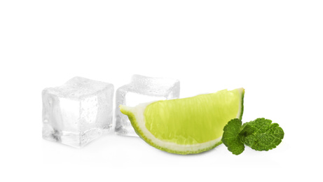 Photo of Ice cubes, mint and lime on white background