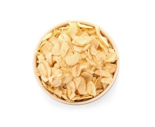 Dried garlic flakes in bowl on white background, top view