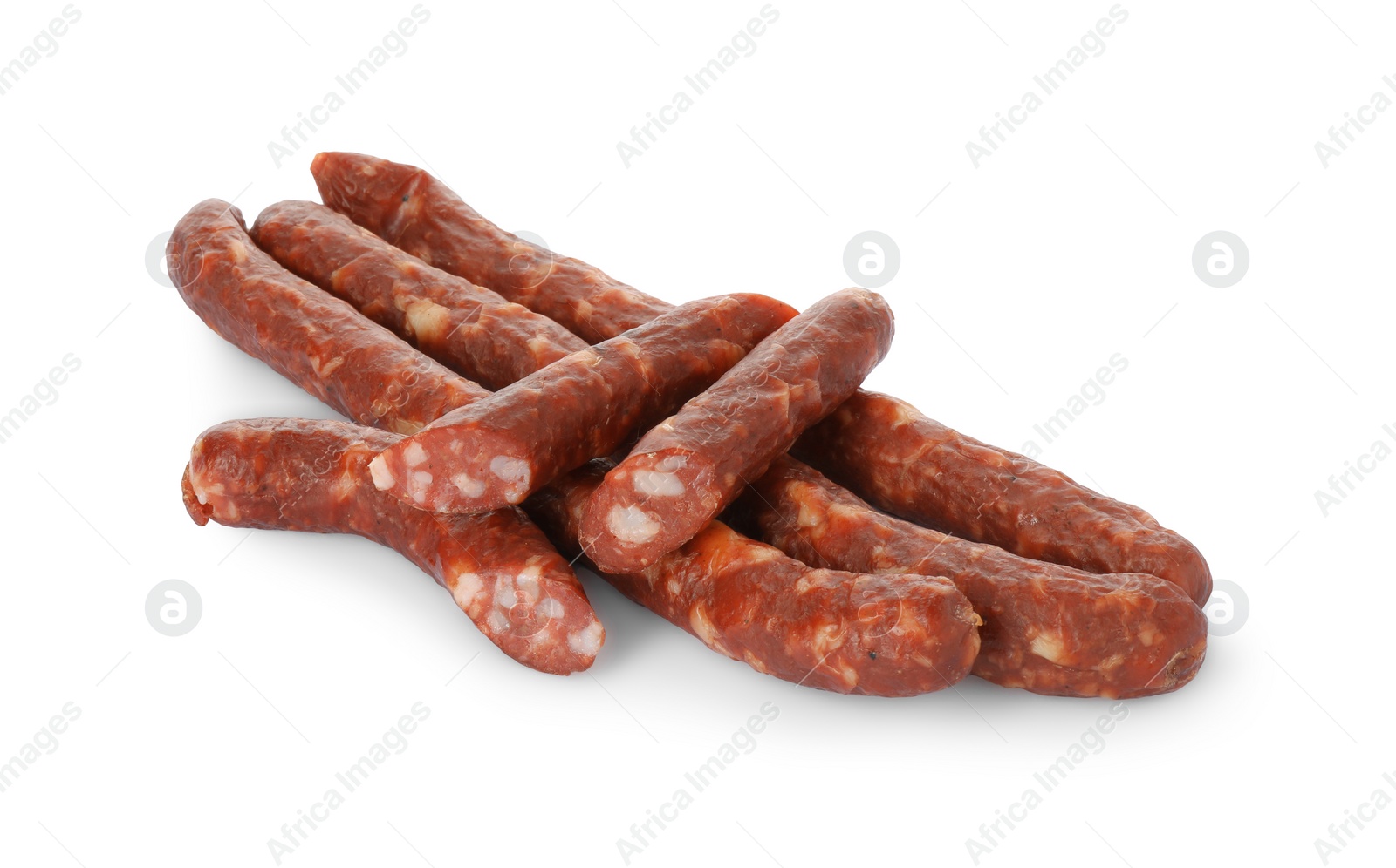 Photo of Thin dry smoked sausages isolated on white