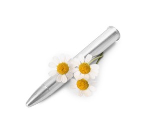 Photo of Metal bullet and beautiful flowers isolated on white