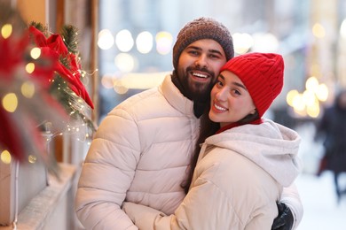 Lovely couple spending time together on city street