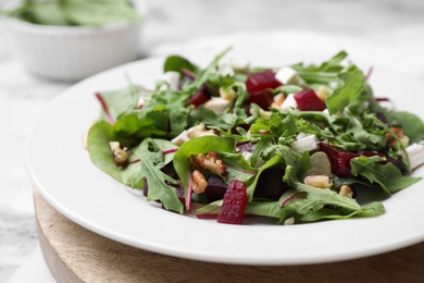 Delicious beet salad served on white table, closeup