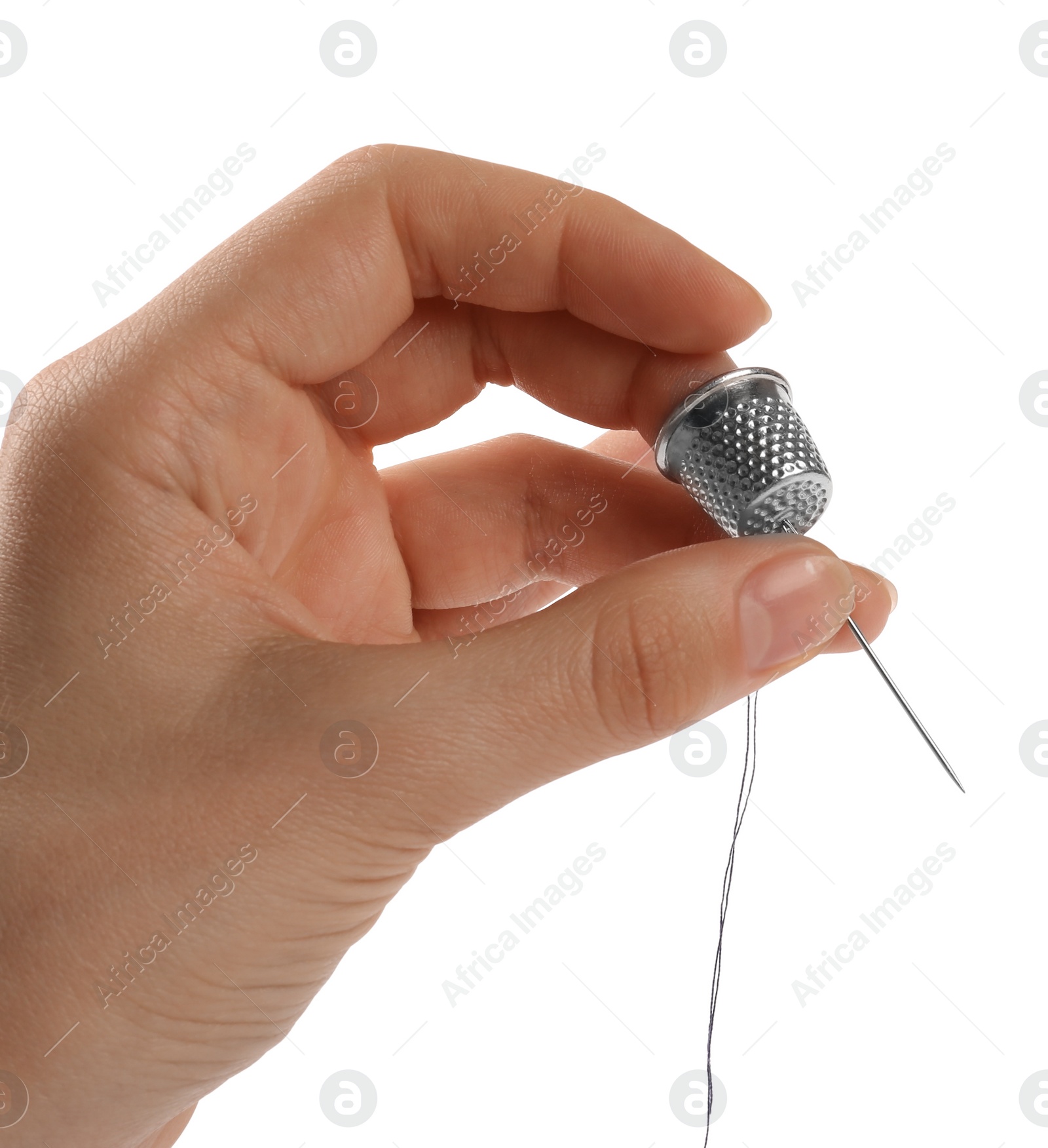 Photo of Woman with thimble, thread and sewing needle on white background, closeup