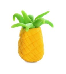 Small pineapple made from playdough on white background