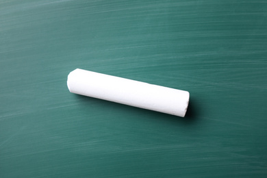 Photo of Piece of white chalk on greenboard, top view