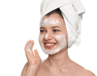 Photo of Young woman washing face with cleansing foam on white background. Skin care cosmetic