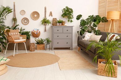 Photo of Living room interior with stylish furniture and green plants