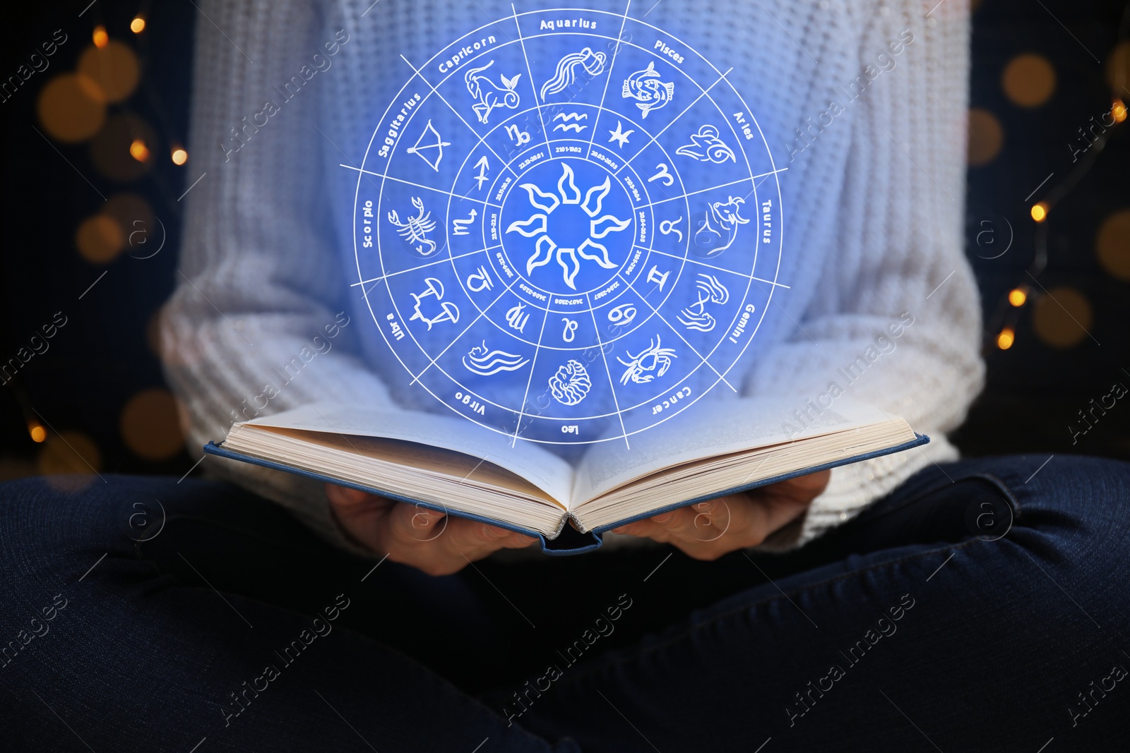 Image of Young woman reading book at home and illustration of zodiac wheel with astrological signs