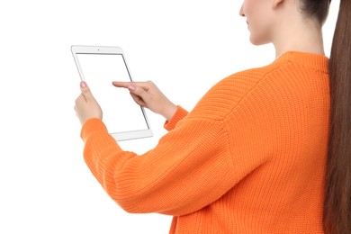 Woman using tablet with blank screen on white background, closeup. Mockup for design